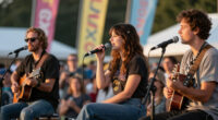 Lucy Dacus Brings Out Brandon Flowers, Hayley Williams, & More At Newport Folk Festival